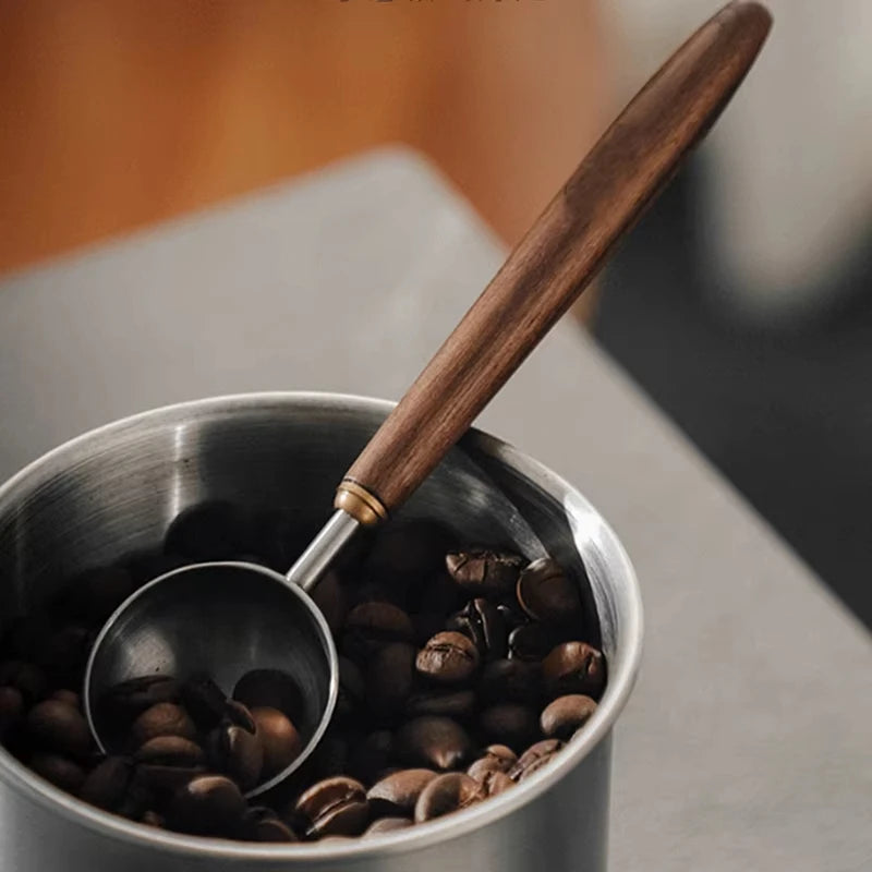Stainless steel coffee scoop with wooden handle, 25ml version.