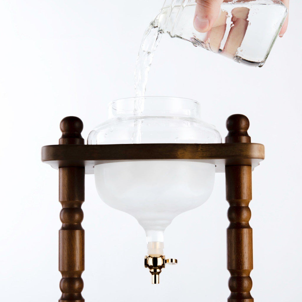 Curved brown wood frame on the Yama 32 oz Cold Brew Tower.
