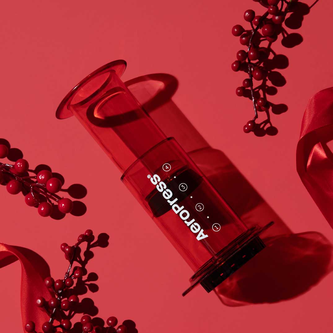 Red version of the 10 oz AeroPress Clear Coffee Maker