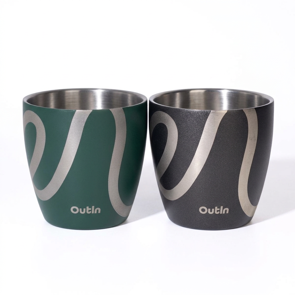 Close-up studio photograph of OutIn espresso cups