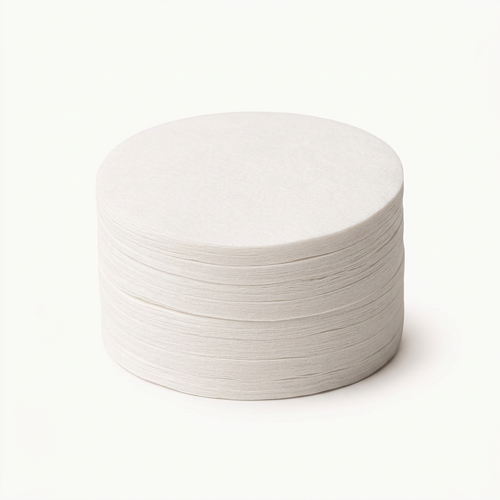 Espresso paper filters on a bright white studio background