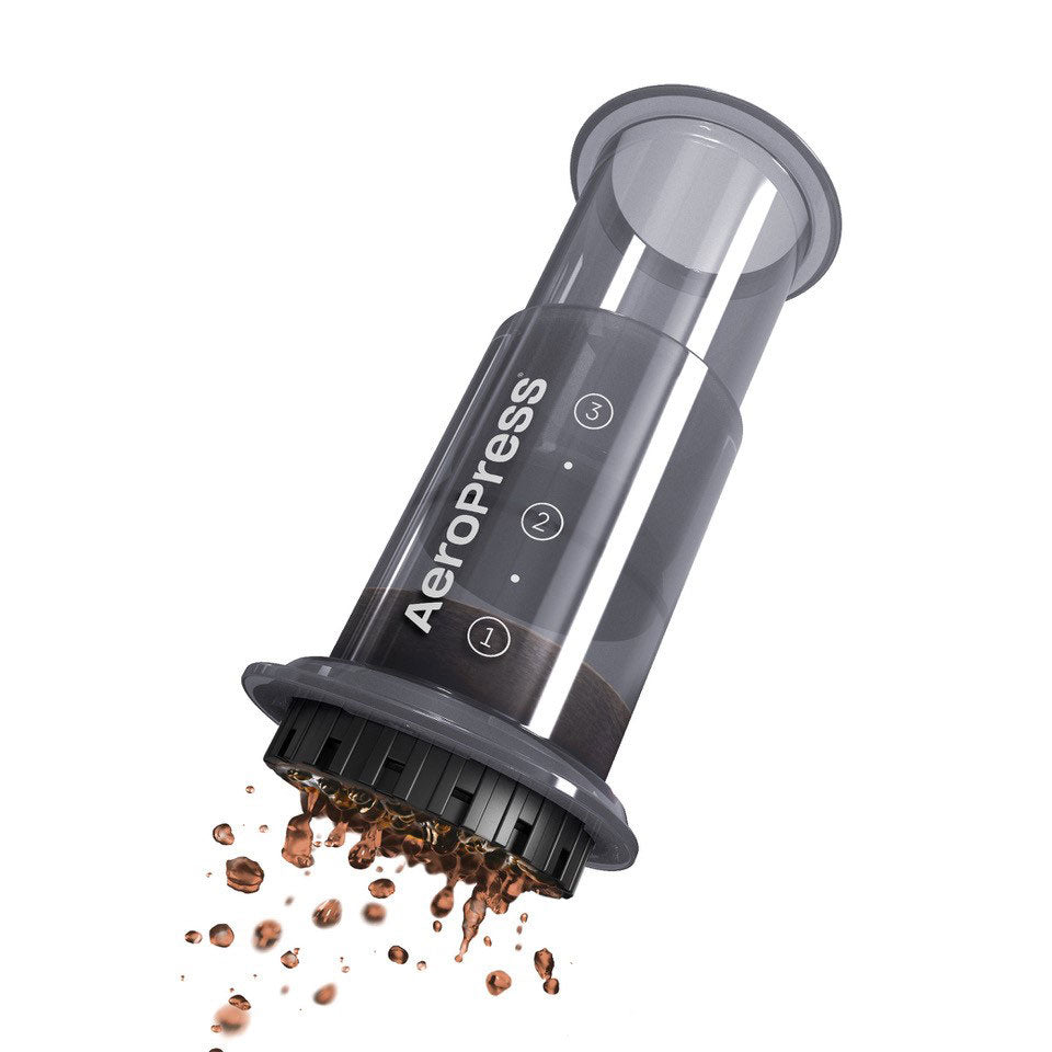 Espresso Parts AeroPress Go Travel Coffee Maker with mug and lid in compact design.