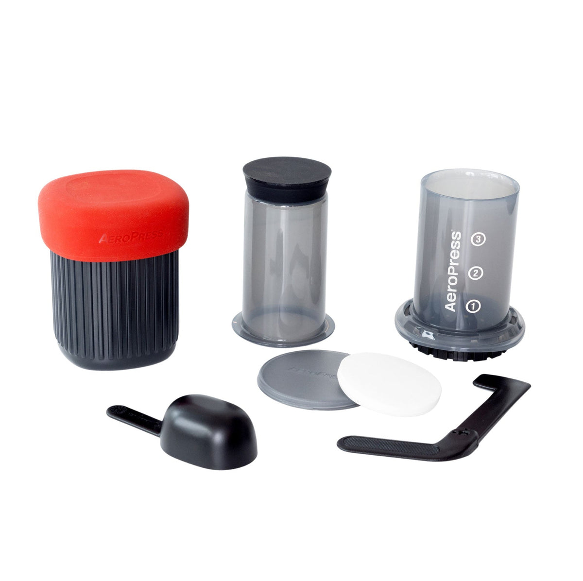 AeroPress Go Travel Coffee Maker in black with mug and lid.