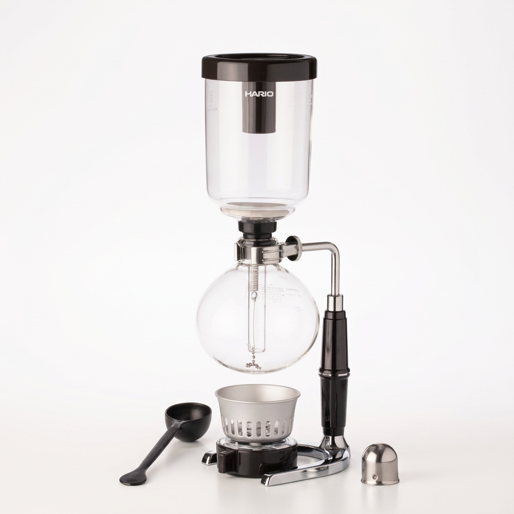 Hario Technica coffee syphon centered upright on bright white with soft warm lighting and a subtle shadow